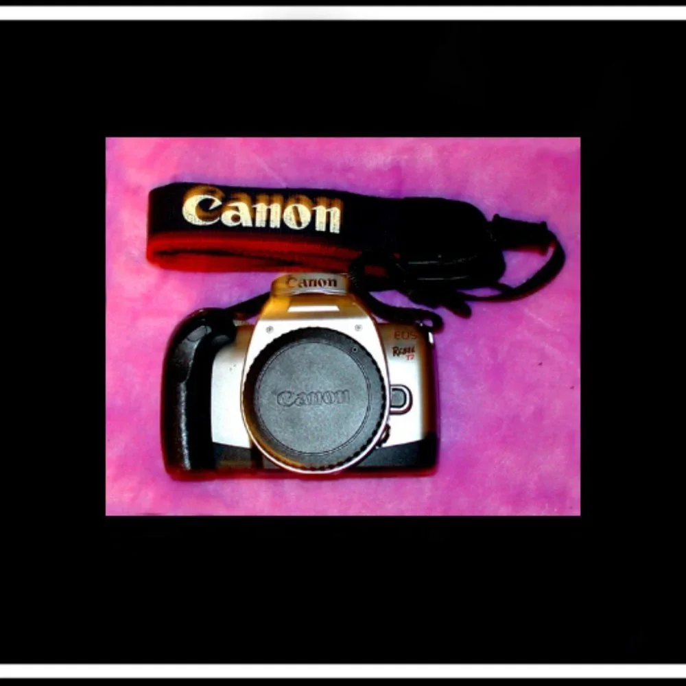 Canon Rebel EOS T2 Photography Camera With An Original Canon Camera Strap